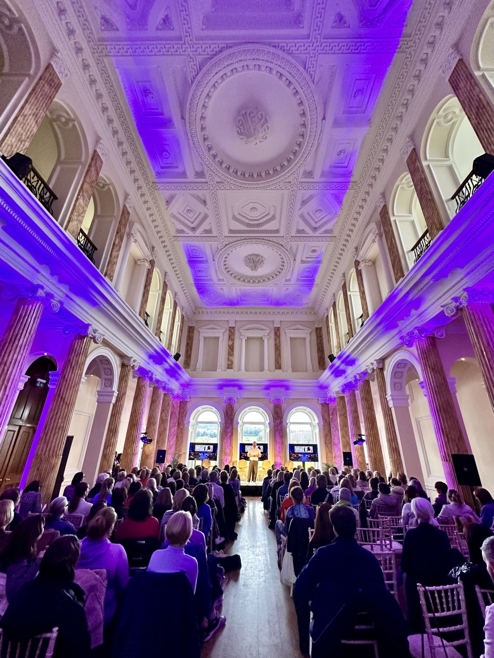 life coach mark fennell speaking in large room